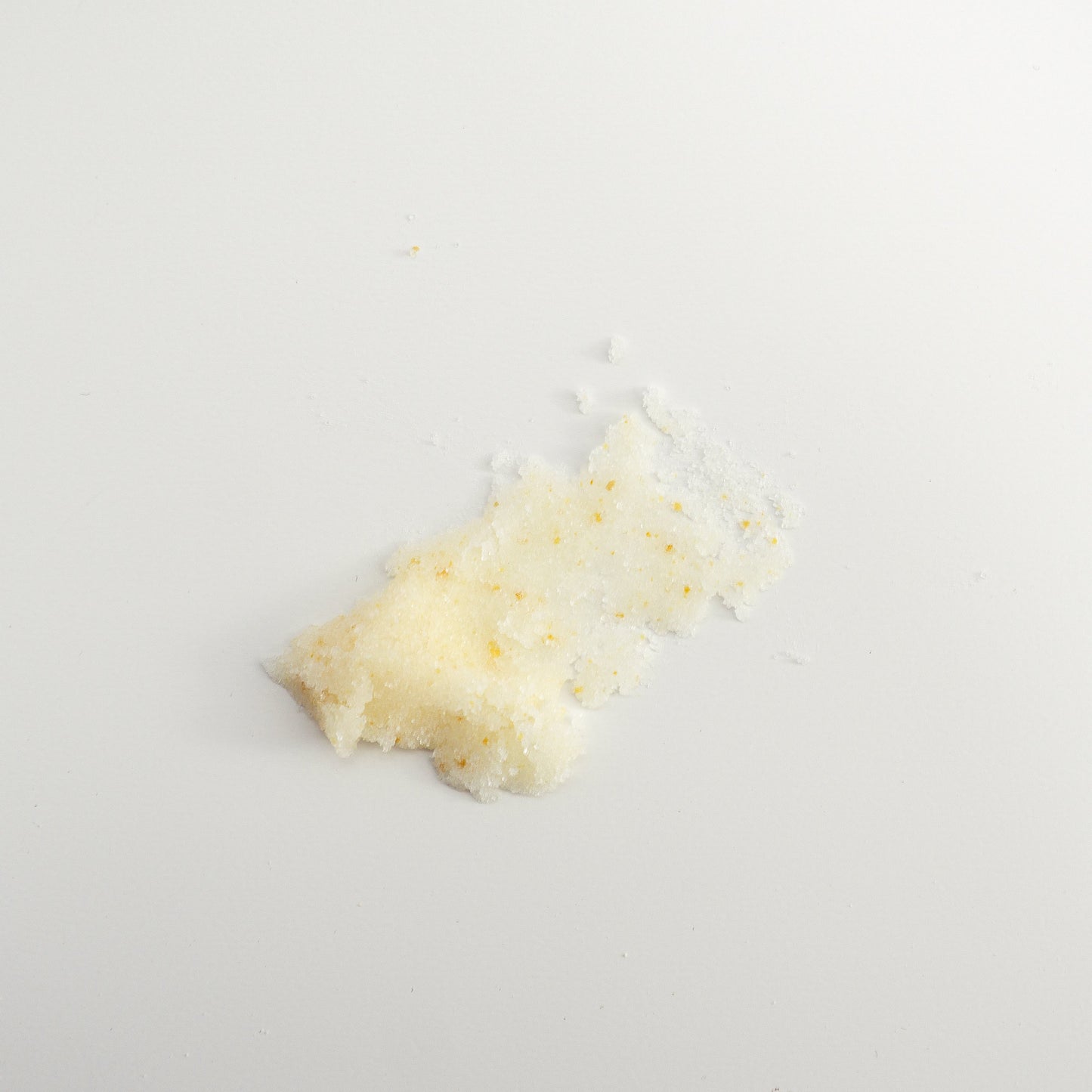 Close up shot of Orange peel sugar body scrub enriched with shea butter and jojoba oil for gentle body exfoliation