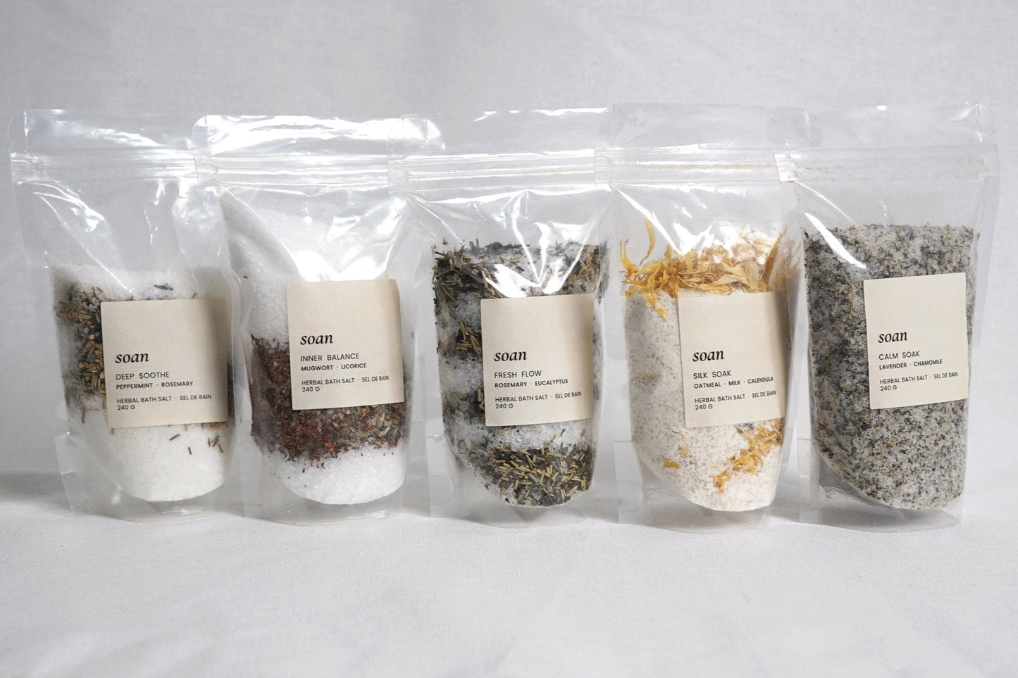 Set of five bath salt bags in assorted blends, featuring natural botanicals and minerals for a full-body self-care ritual