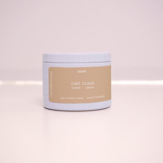 Cafe Cloud Tin soy candle on a light pink background