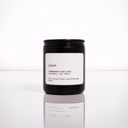 Cinnamon Chai Latte jar candle in matte black vessel with wooden wick, hand-poured with soy-coconut wax and spiced vanilla scent