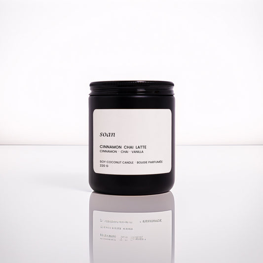 Cinnamon Chai Latte jar candle in matte black vessel with wooden wick, hand-poured with soy-coconut wax and spiced vanilla scent