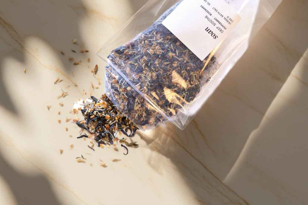 Bath Tea package with loose tea leaves on a marble surface