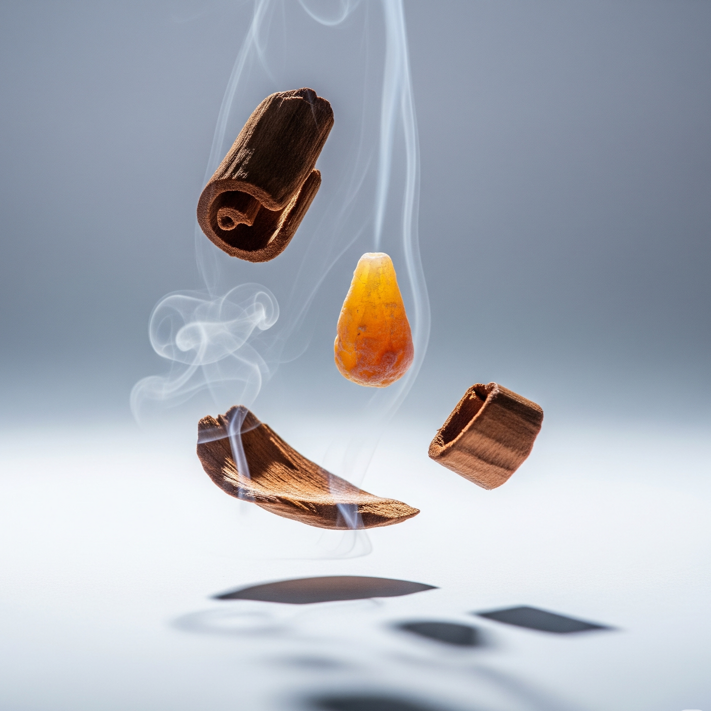 Wooden incense cones with smoke on a gray background