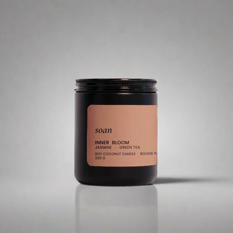 Candle jar with a label on a white background