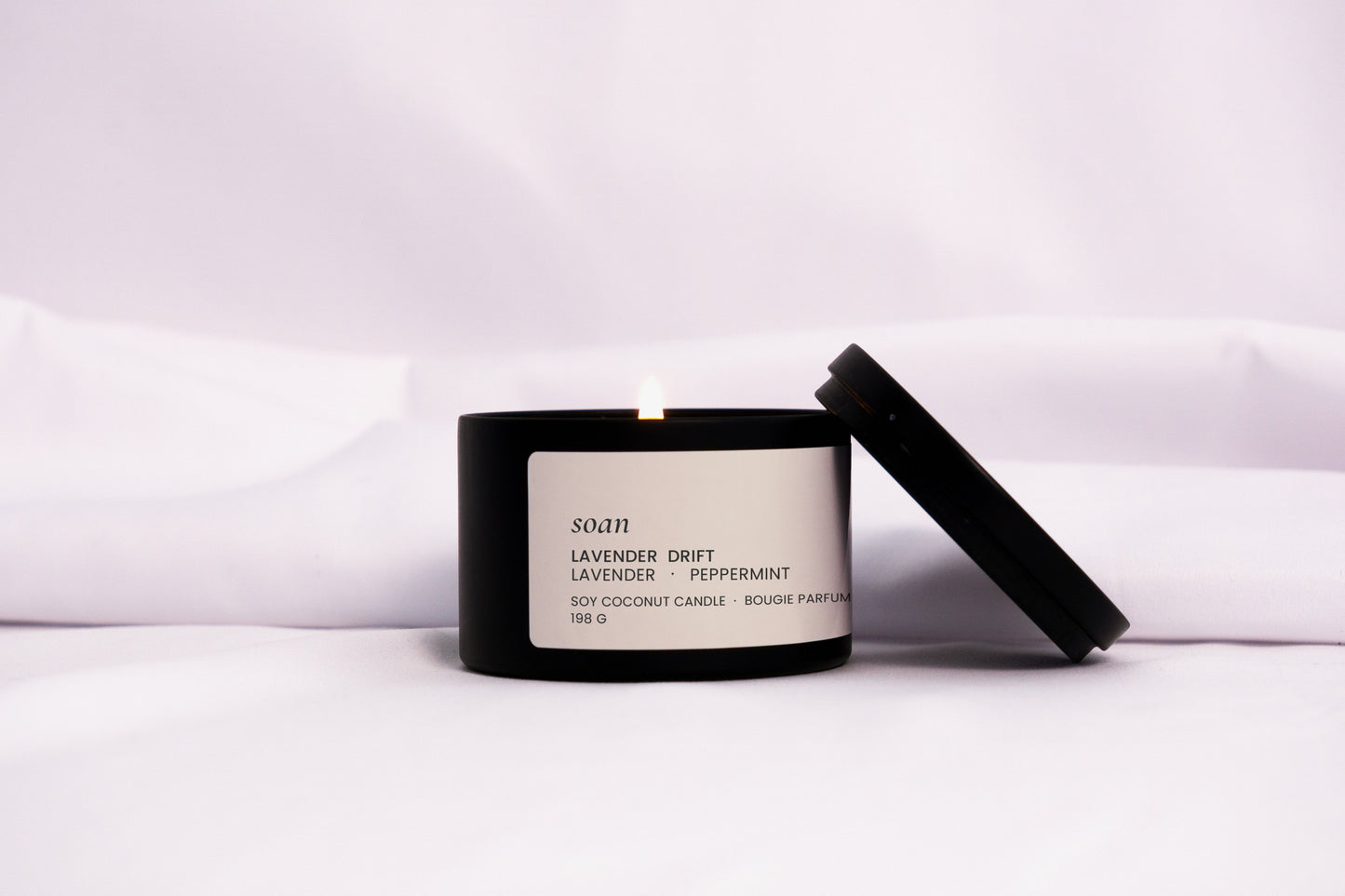 Lavender Drift tin candle in black matte jar with cotton wick, hand-poured and scented with calming lavender and mint