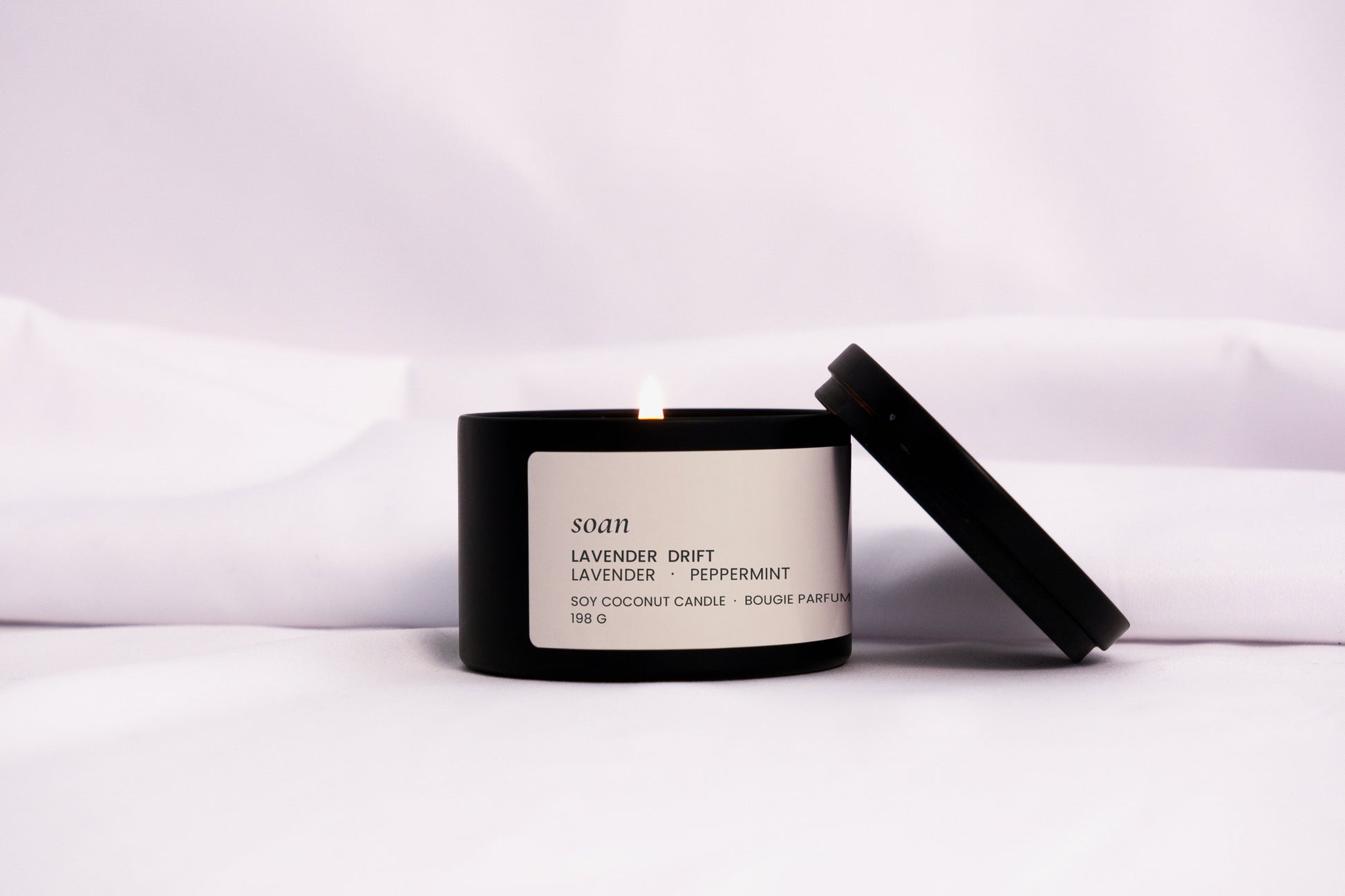 Lavender Drift tin candle in black matte jar with cotton wick, hand-poured and scented with calming lavender and mint