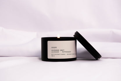 Lavender Drift tin candle in black matte jar with cotton wick, hand-poured and scented with calming lavender and mint