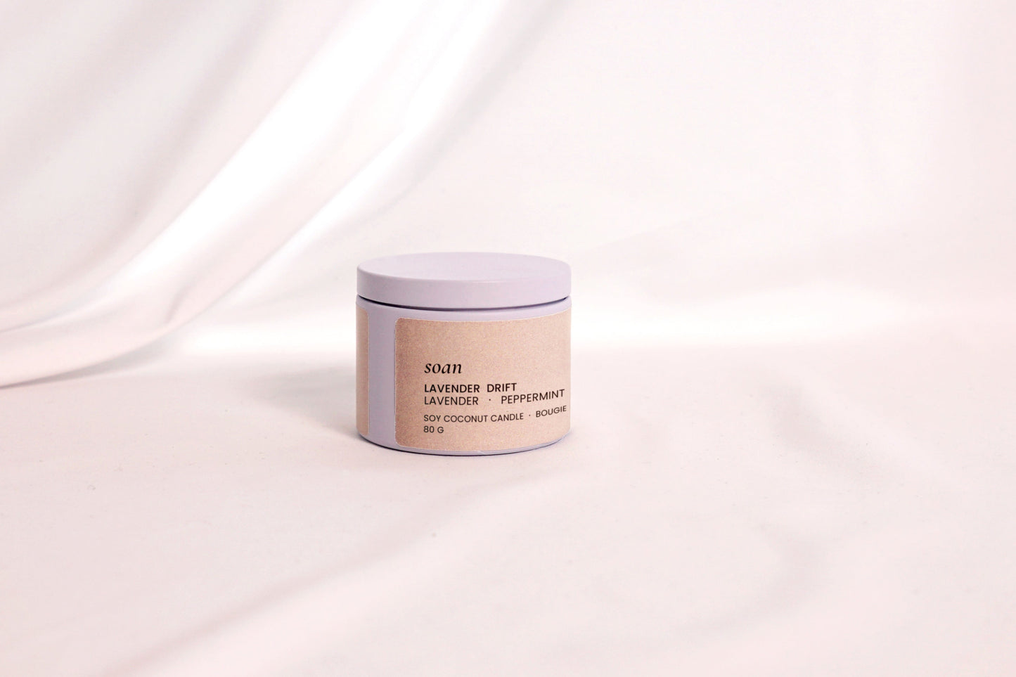 Close-up of Lavender Drift tin candle label and smooth soy-coconut wax, crafted for clean, gentle aromatherapy

