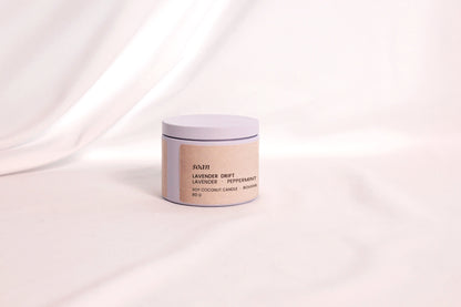 Close-up of Lavender Drift tin candle label and smooth soy-coconut wax, crafted for clean, gentle aromatherapy

