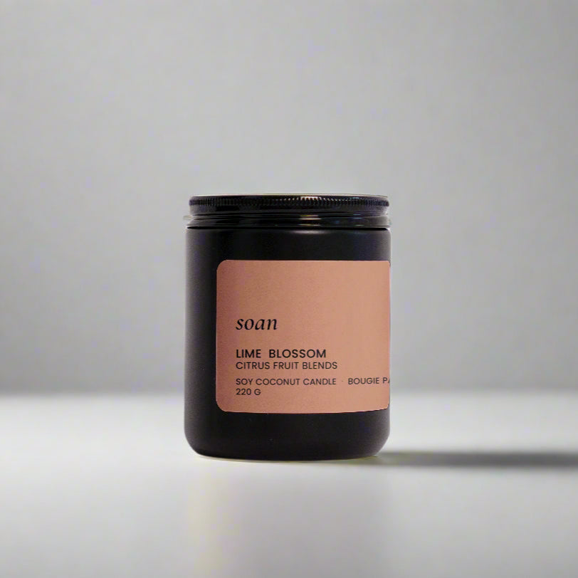 Candle jar with a label on a white background