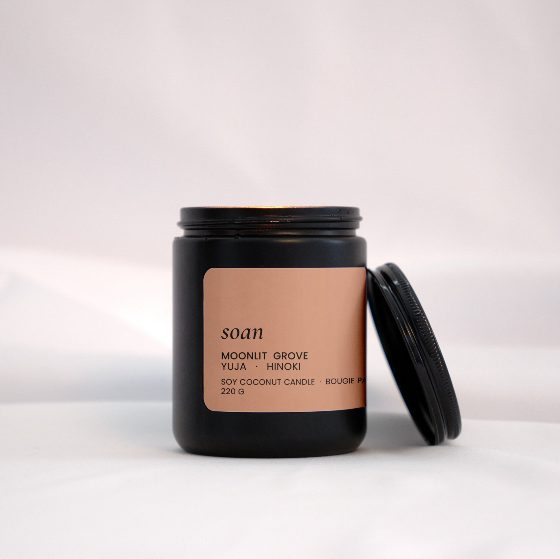 Soan Moonlit Grove Candle jar with a soan label on a white background