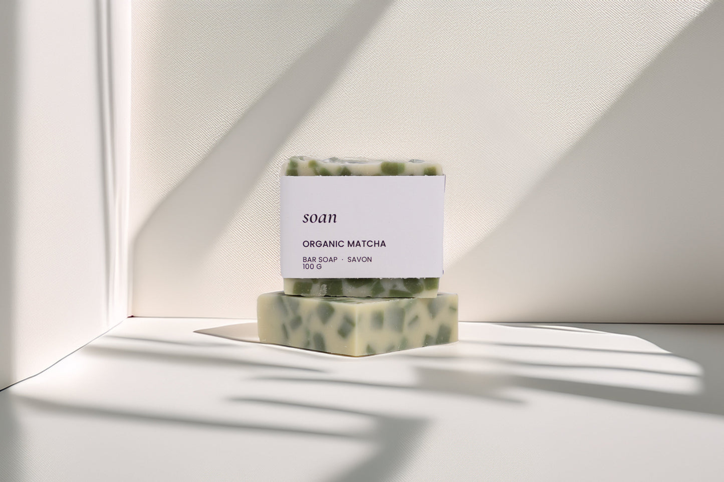 Bar of soap with a label on a white surface