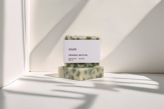 Bar of soap with a label on a white surface