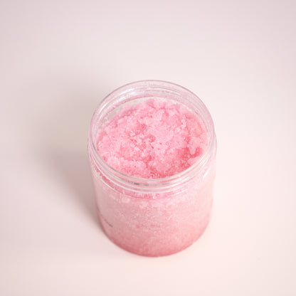 Jar of pink bath salt on a white background