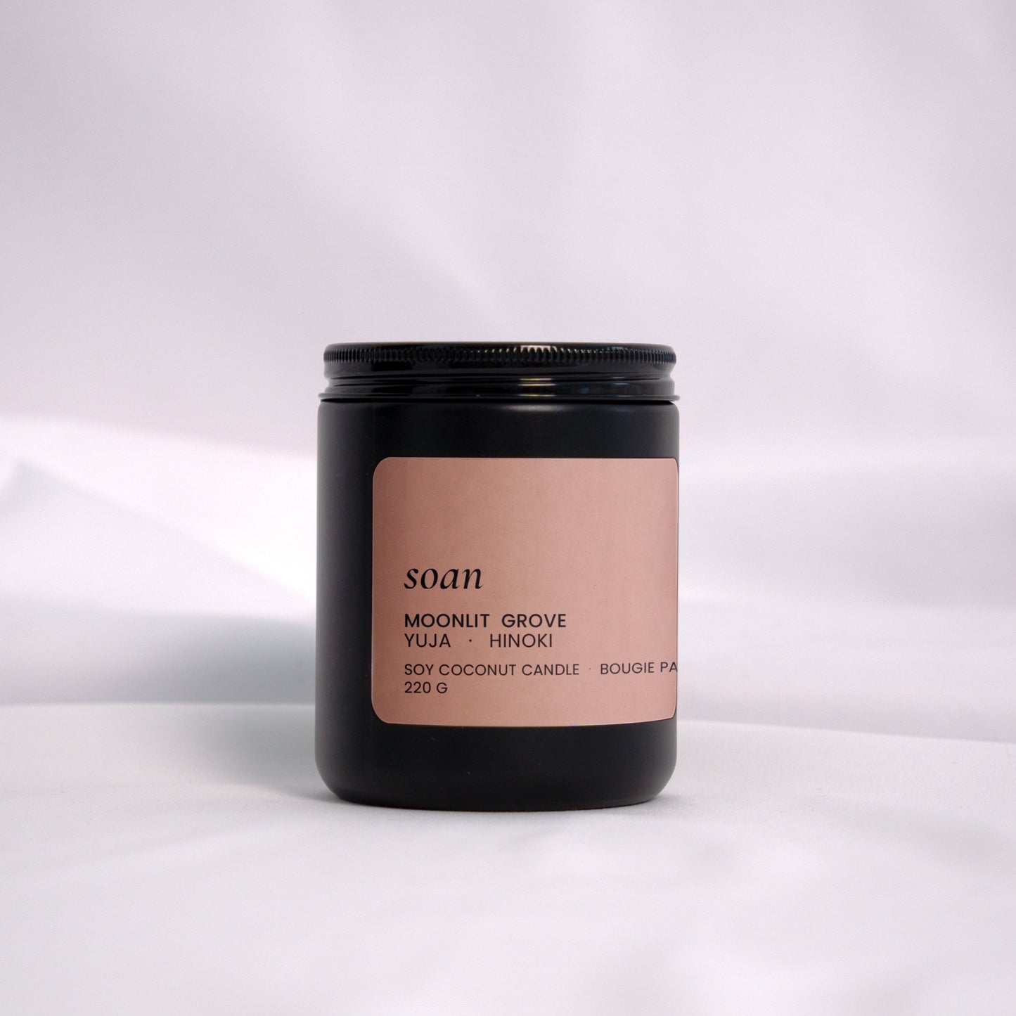 Moonlit Grove soy candle in a soft matte jar, hand-poured with notes of cypress, neroli, and amber