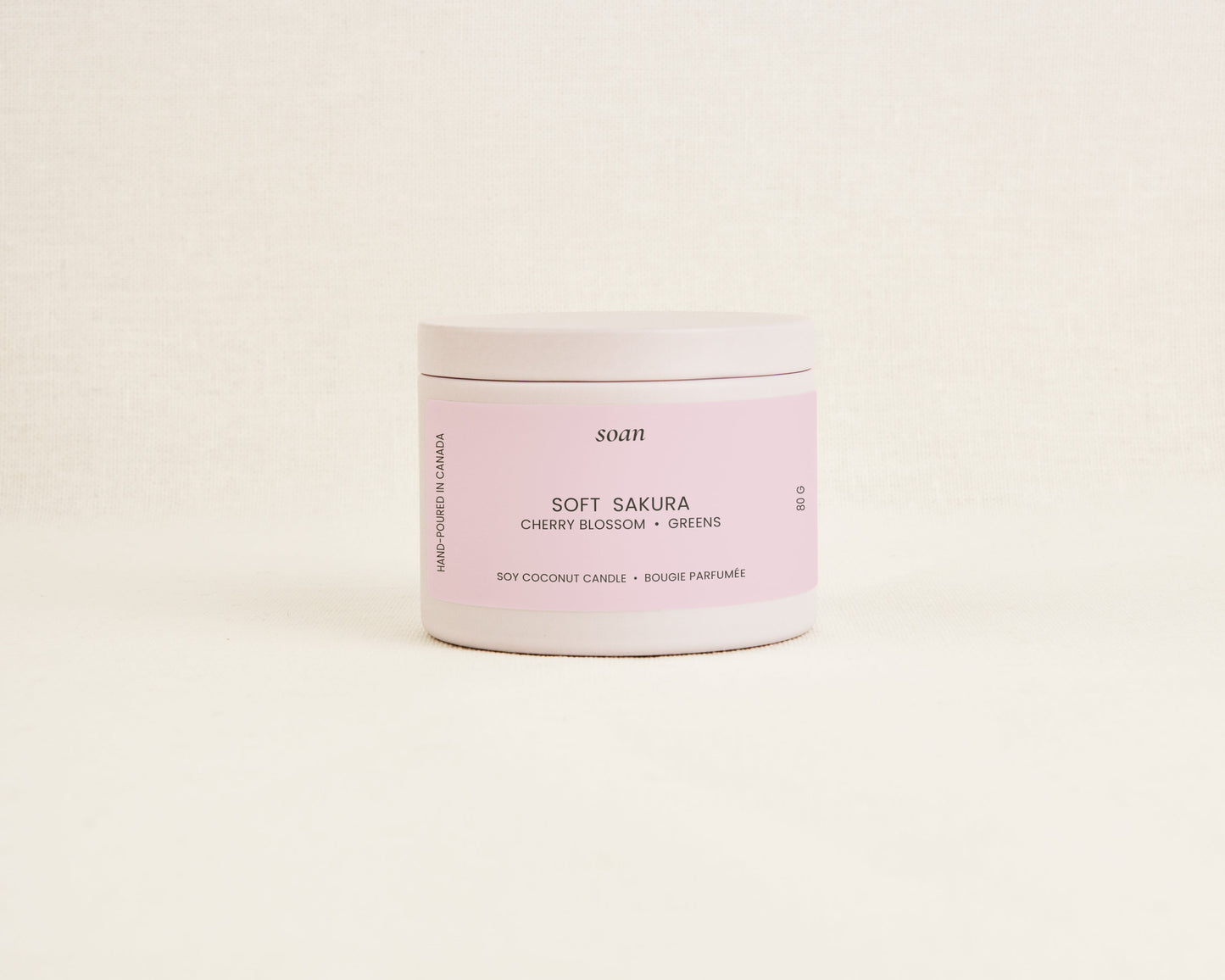 Soft Sakura cherry blossom soy coconut candle in white tin with cotton wick and floral spring fragrance by Soan