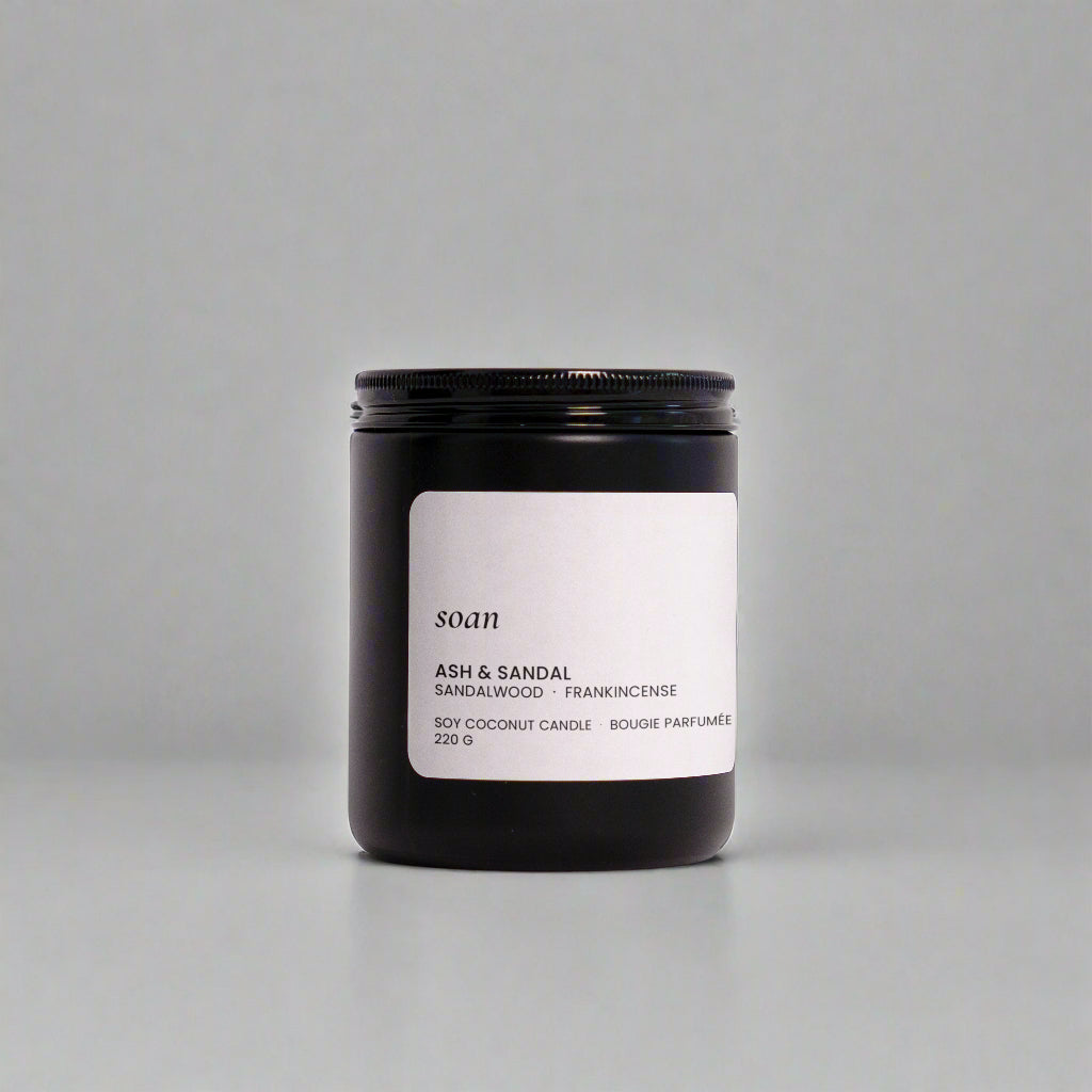 Candle jar with a label on a white background