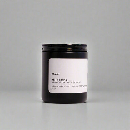Candle jar with a label on a white background