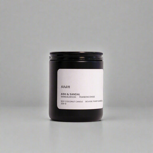 Candle jar with a label on a white background