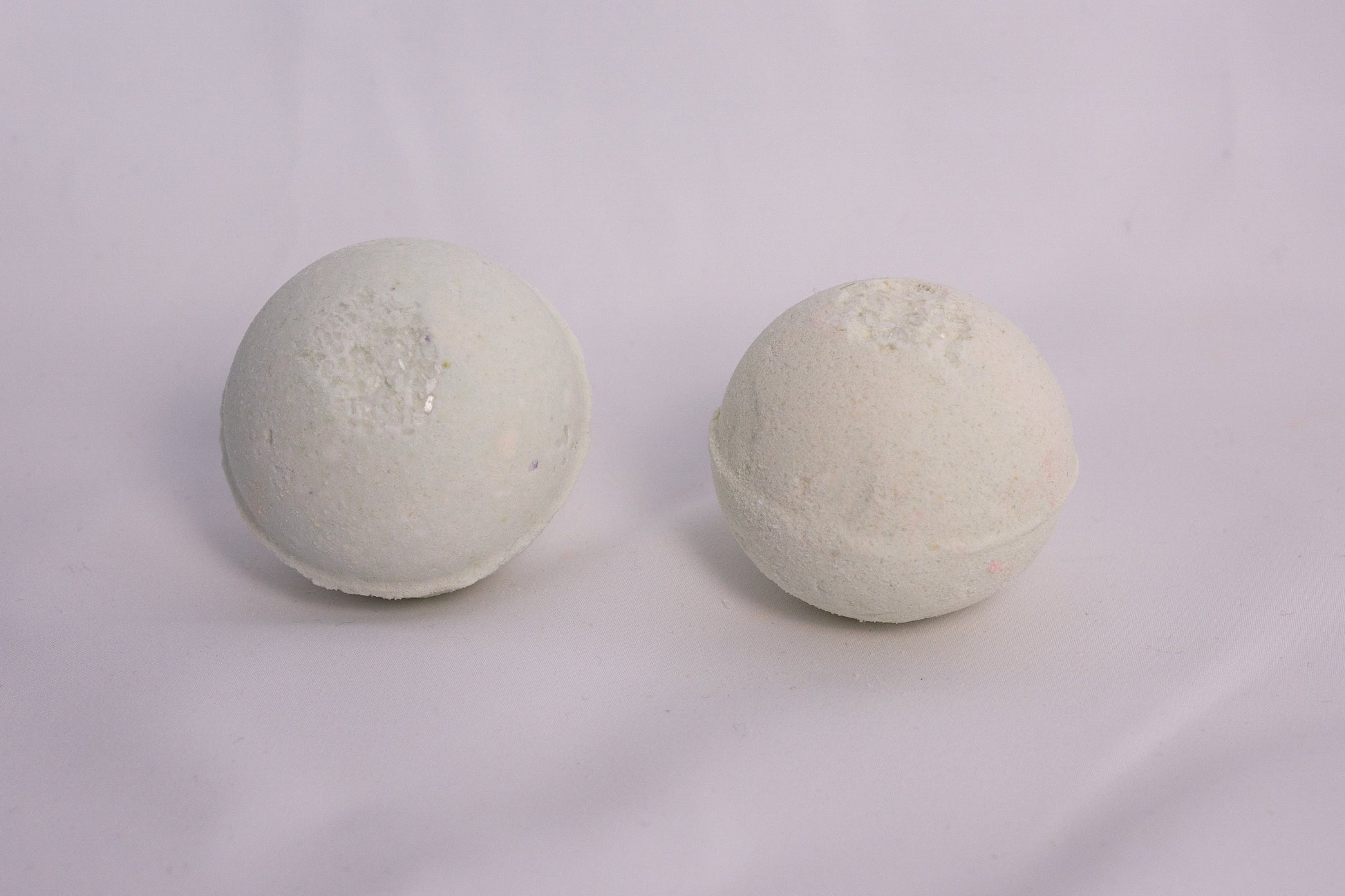 Bath bomb styled with pine and moss elements, evoking the scent of a tranquil forest soak
