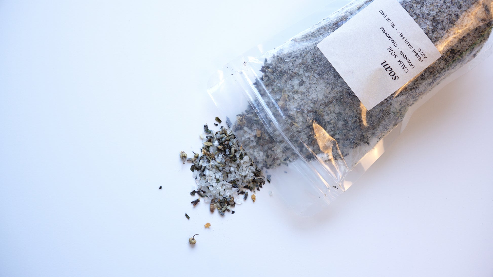 Close-up of Calm Soak bath salt with dried florals and mineral-rich salts, ideal for evening wind-down rituals
