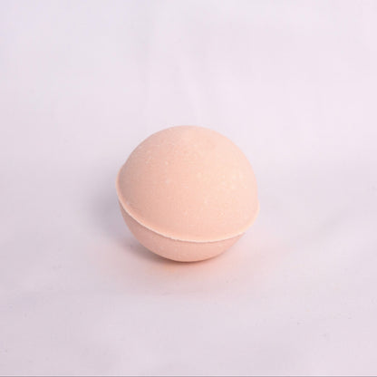 Sweet orange and pink grapefruit Bubble Bath Bomb with creamy texture, hand-pressed and infused with juicy fruity orange and grapefruit essential oils for a revitalizing aromatherapy bath