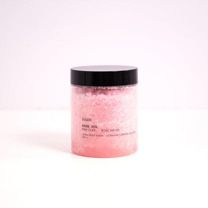 Pink jar with black lid on a white background