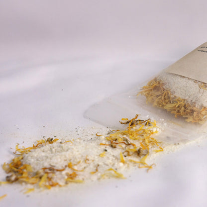 Silk Soak bath salt blend with milk powder and calendula, designed to soften and hydrate sensitive skin