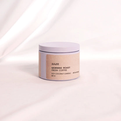 Close-up of Morning Roast candle label and tin container, evoking the scent of freshly brewed coffee in a portable form