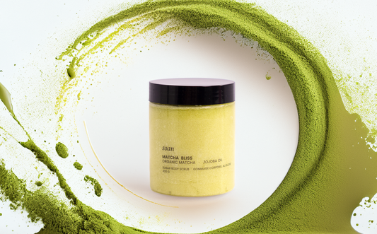 Jar of matcha powder with green matcha dust on a white background