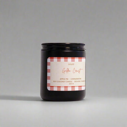 Candle jar with a label on a white background
