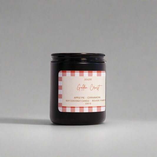 Candle jar with a label on a white background