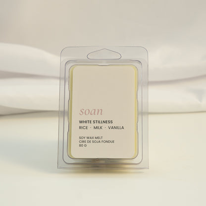 Scented wax melt packaging with 'soan' branding on a white fabric background