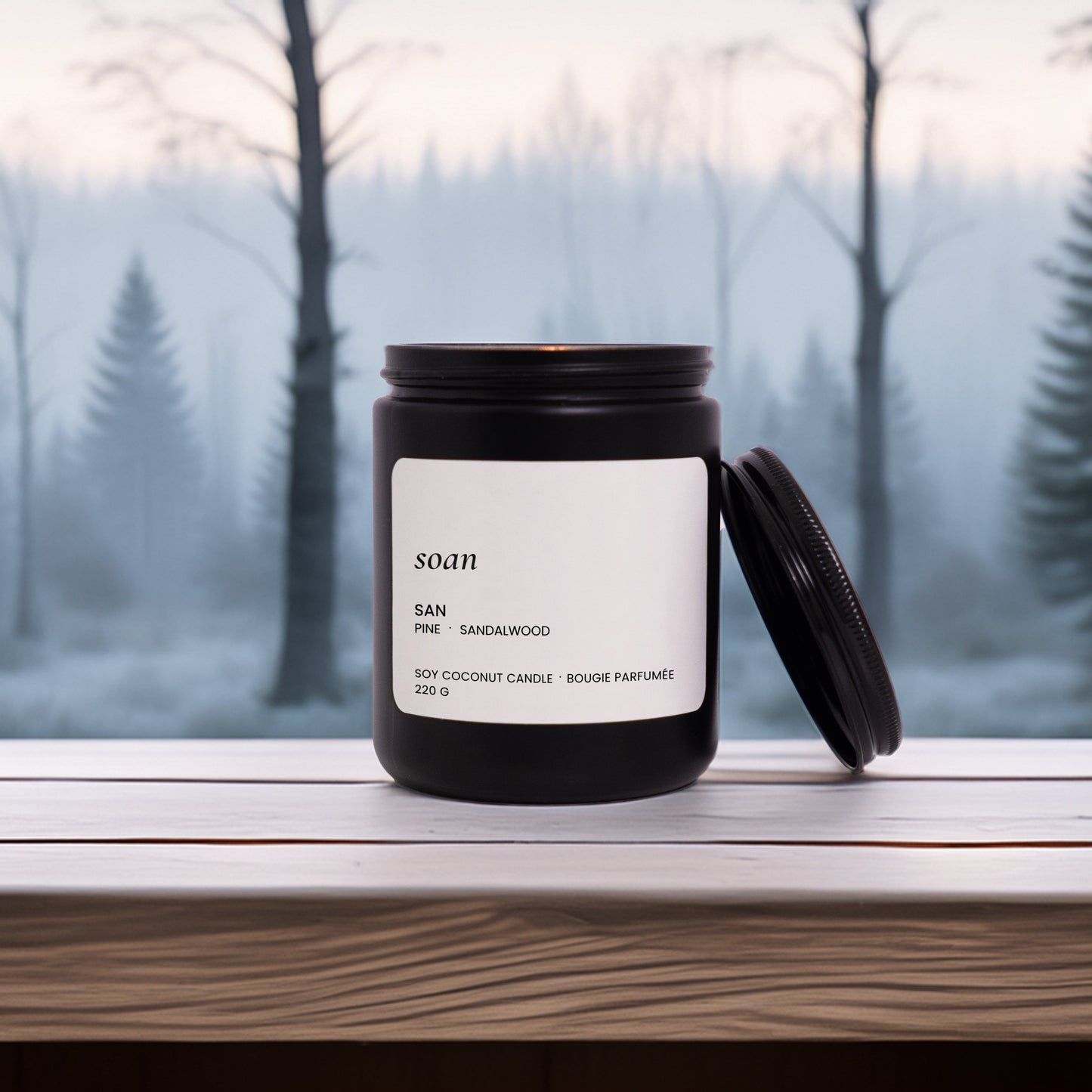 Candle with a label on a windowsill with a forest background