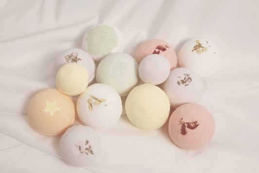Assorted bath bomb collection featuring multiple scents, handcrafted with natural ingredients for soothing, luxurious bath rituals