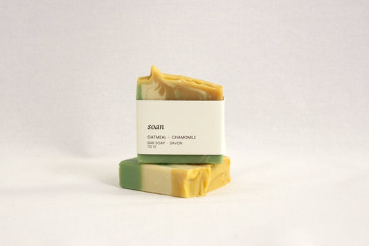 Handmade chamomile oatmeal soap bar infused with whole chamomile flowers and colloidal oatmeal, ideal for sensitive or dry skin. Vegan, palm oil-free, and crafted in small batches with natural ingredients for a soothing, hydrating cleanse. Calming, fragrance-free cold process soap perfect for face and body, eco-conscious skincare, and gentle daily self-care routines.