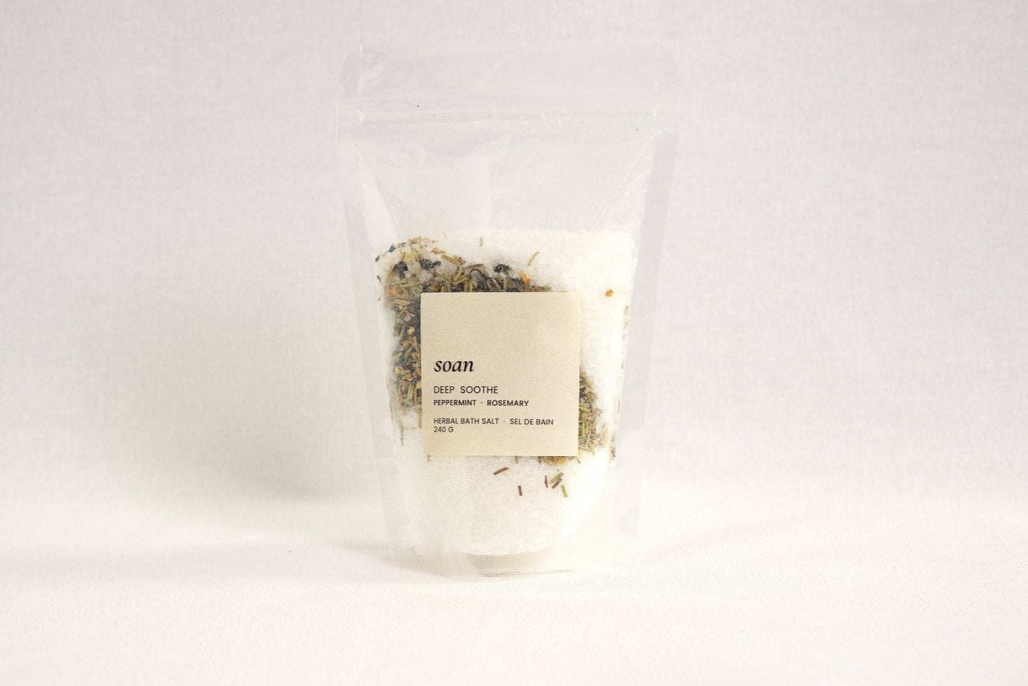 Deep Soothe bath salt blend with calming herbs and minerals, crafted to ease tension and relax the body