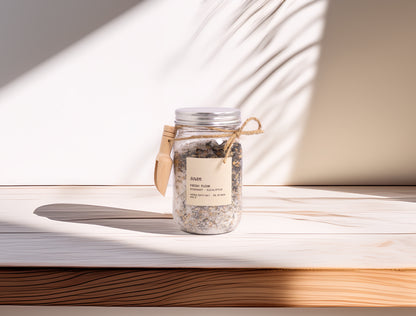 Jar of bath salts on a wooden surface with soft lighting