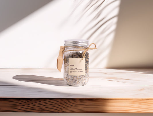 Jar of bath salts on a wooden surface with soft lighting