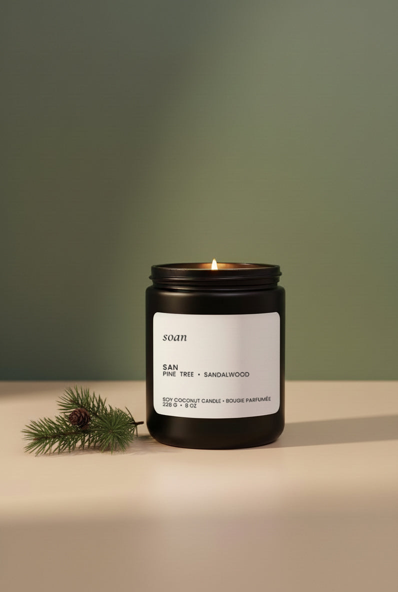black candle with forest woody scent