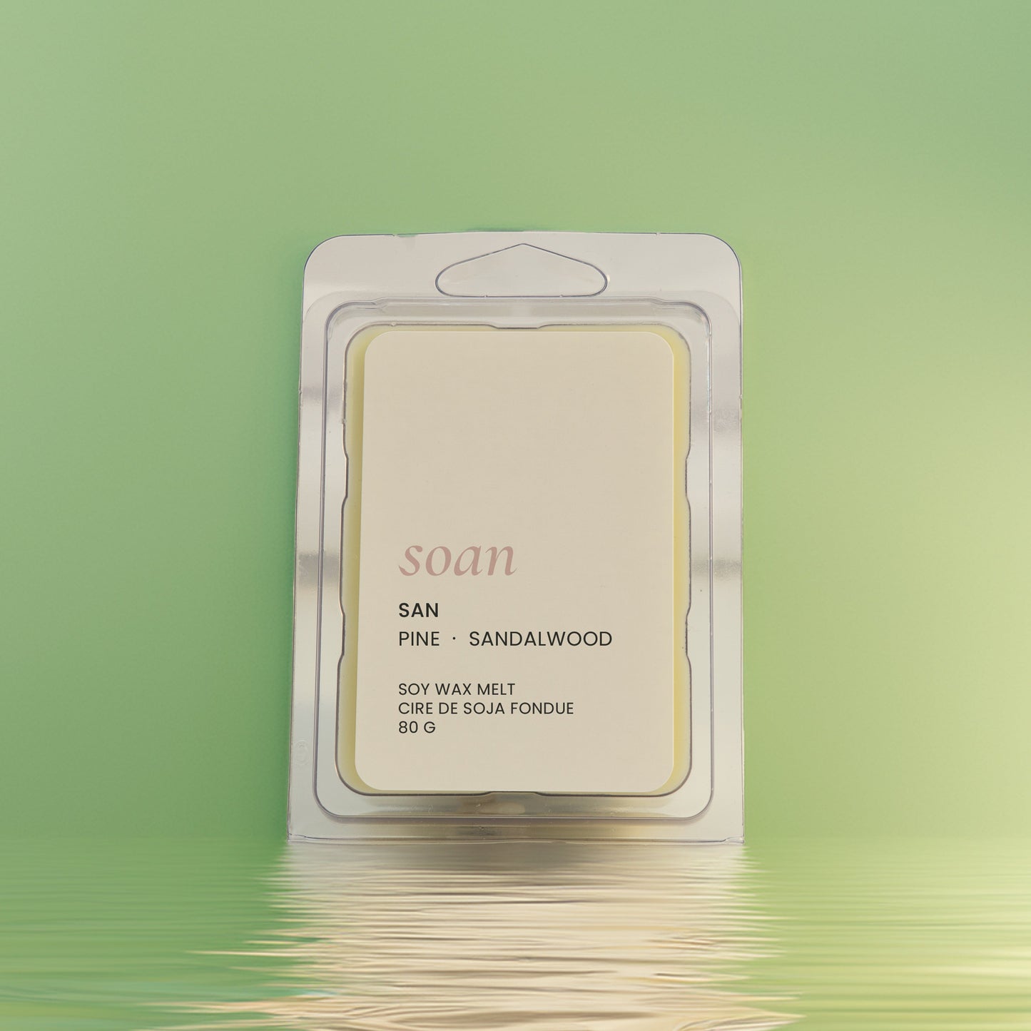 Wax melt package labeled 'soan' on a green background
