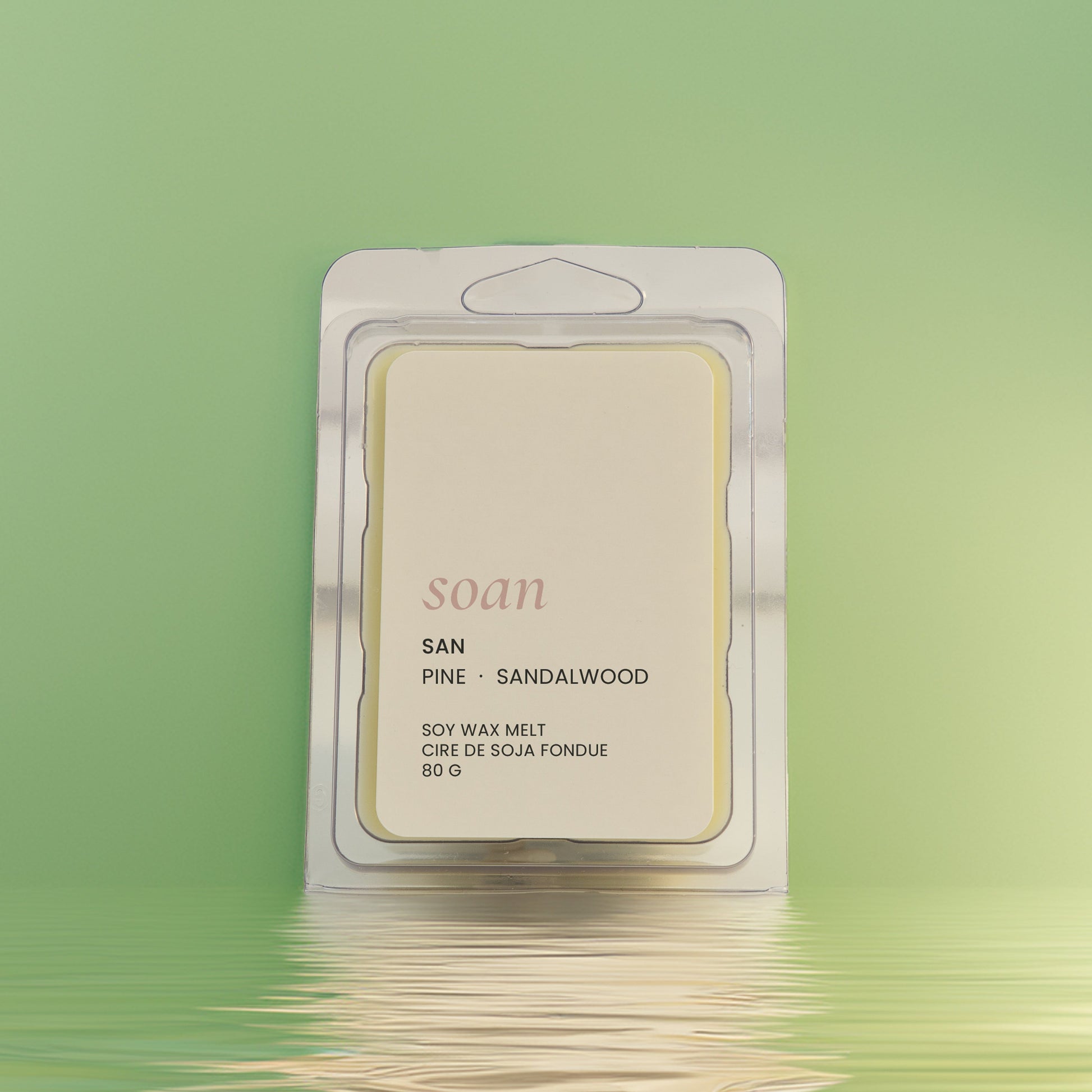 Wax melt package labeled 'soan' on a green background