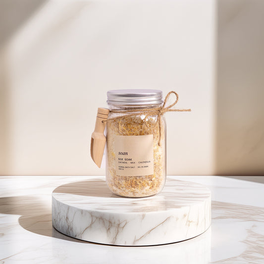 Jar of Bath tea and Bath Salt  on a marble surface with a neutral background