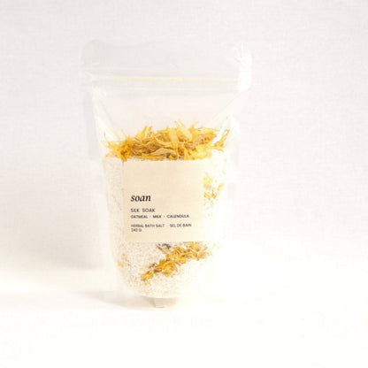 Silk Soak bath salt blend with milk powder and calendula, designed to soften and hydrate sensitive skin
