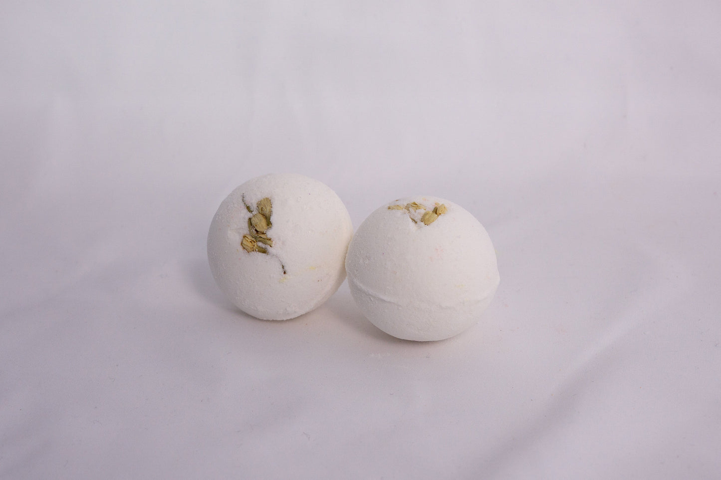 Jasmine Bubble Bath Bomb with smooth finish, hand-pressed and infused with creamy jasmine fragrance for a relaxing soak